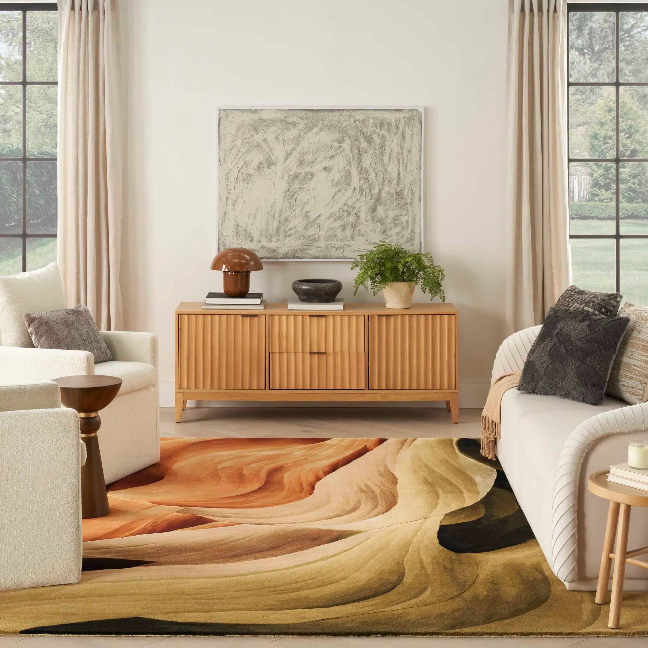 Interior living space featuring a textured area rug, wooden sideboard, and decorative items.