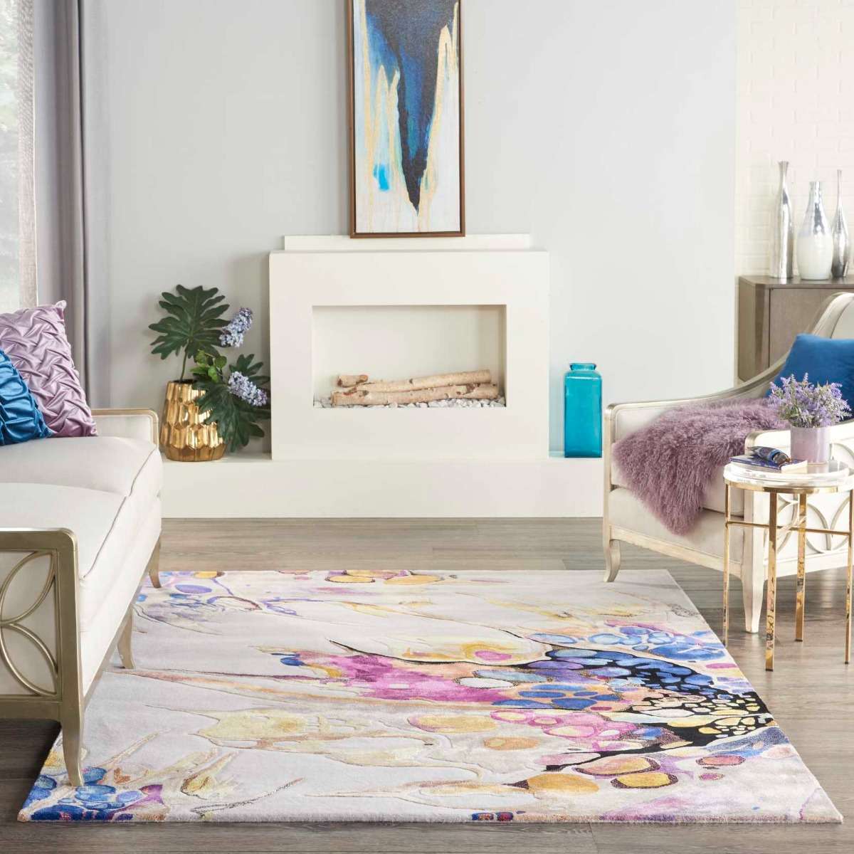 Colorful abstract area rug on a living room floor with a fireplace and furniture